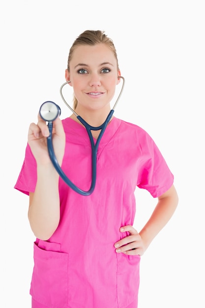 Happy doctor holding a stethoscope