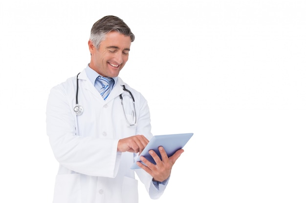 Happy doctor using tablet pc