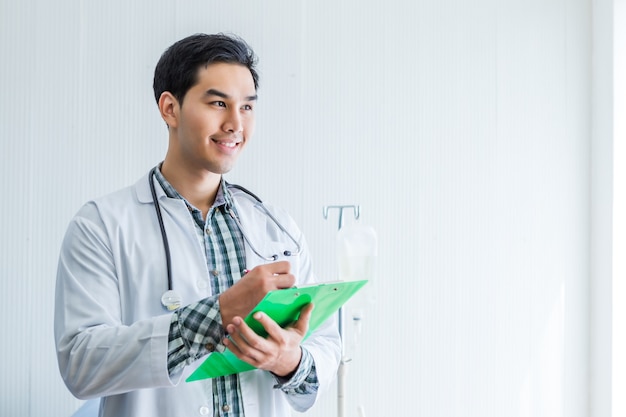 Happy doctor with a clipboard