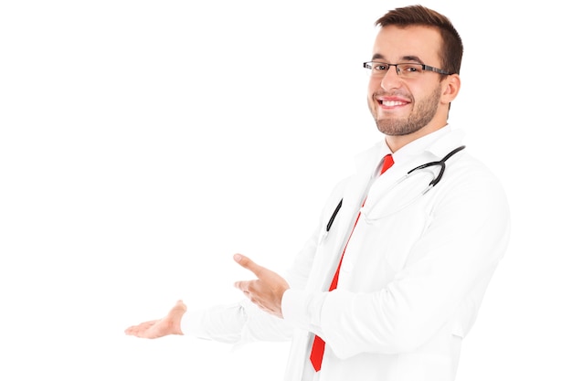 a happy doctor with stethoscope showing your product over white background