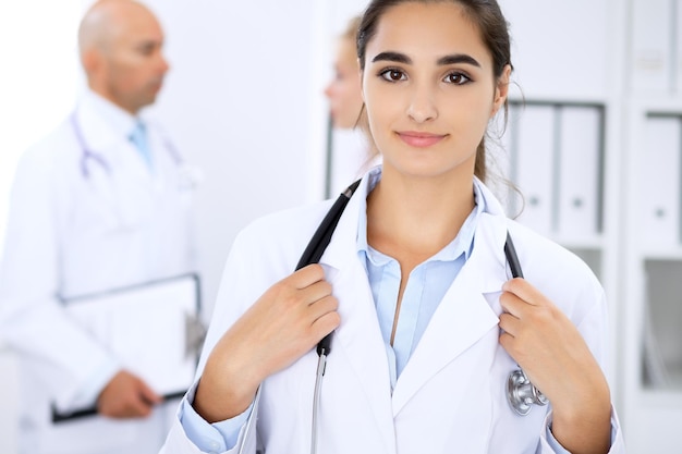 Happy doctor woman  with medical staff at the hospital