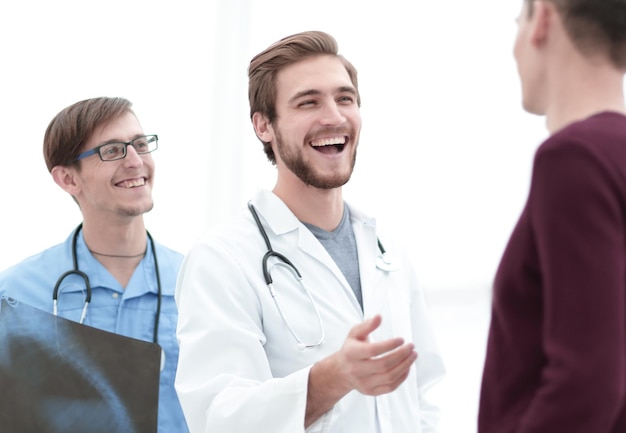 Happy doctors with xray of the patient