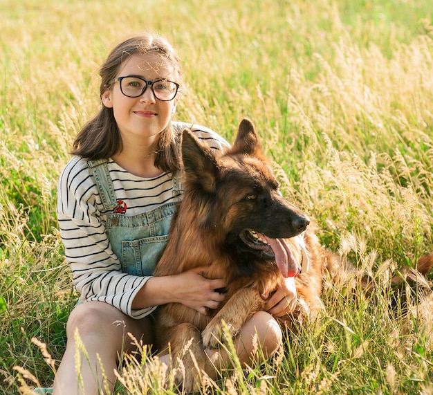 Happy dog and owner enjoying nature in the park