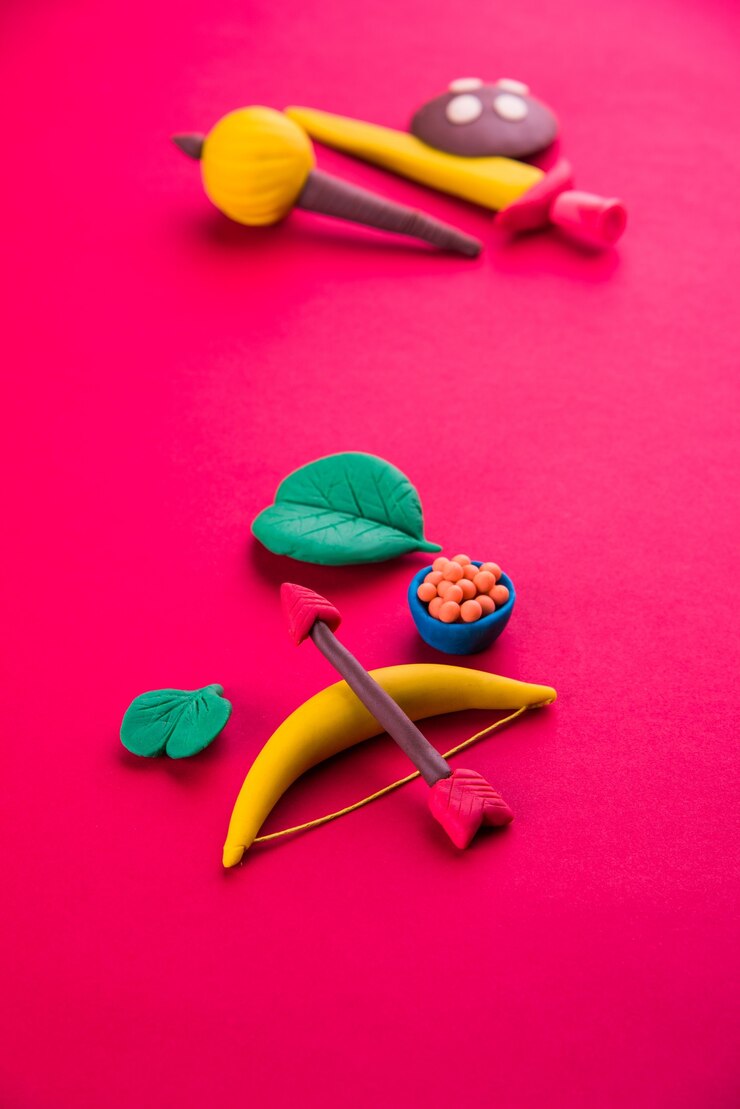 फोटो happy dussehra or ayudh puja greeting card showing photograph of clay model of arms used in ramayana or mahabharata