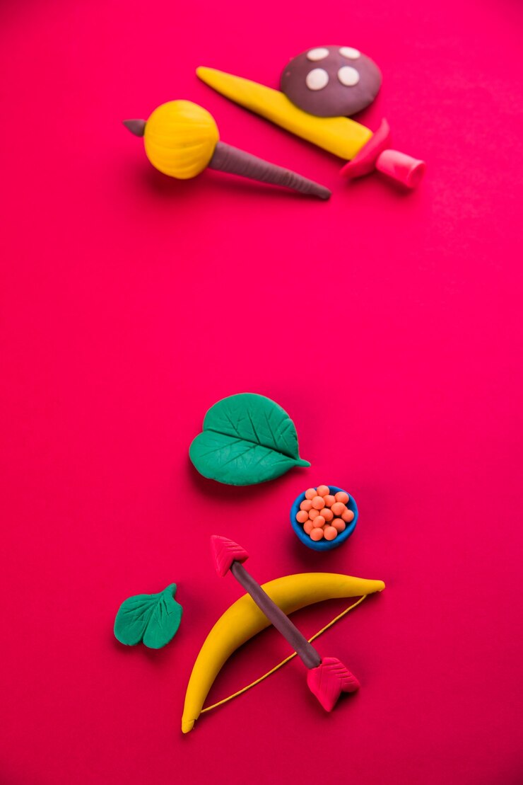 फोटो happy dussehra or ayudh puja greeting card showing photograph of clay model of arms used in ramayana or mahabharata