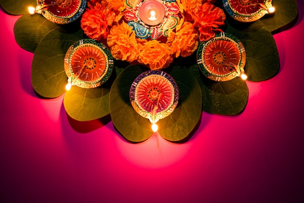 Happy Dussehra. Clay Diya lamps lit during Dussehra, Indian Festival concept.