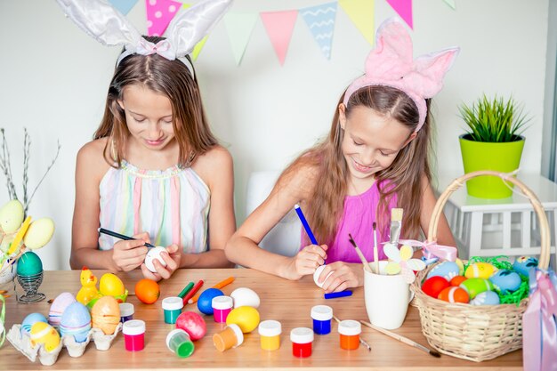 Happy easter. Beautiful little kids wearing bunny ears on Easter day.