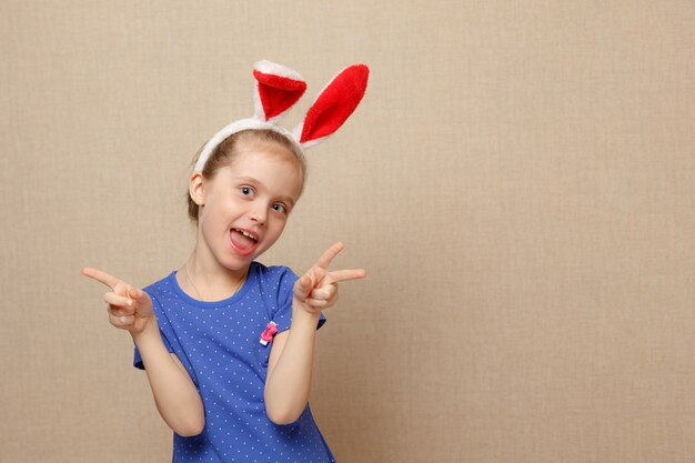 Happy easter. Child girl with bunny ears.