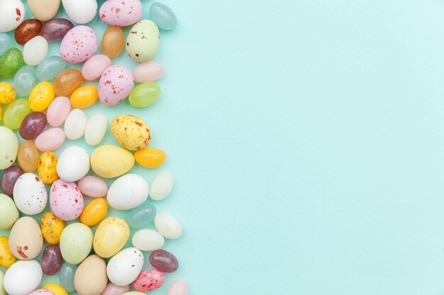 Happy easter concept preparation for holiday easter candy chocolate eggs and jellybean sweets isolat...