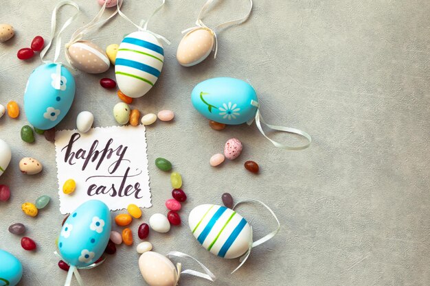 Happy easter concept preparation for holiday easter eggs inscription happy easter letters candy choc.