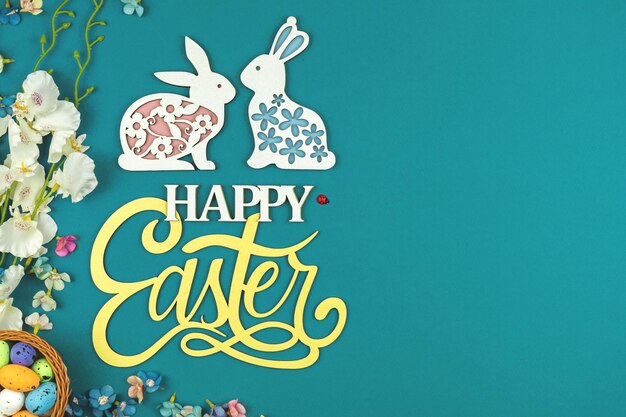 Happy Easter concept with easter eggs and beautiful happy easter wooden text easter background with copy space