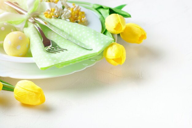 Happy Easter. Congratulatory easter background. Easter eggs and flowers.