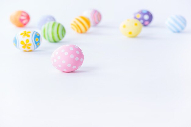 Happy Easter day colorful eggs and blurred on white background with copy space.