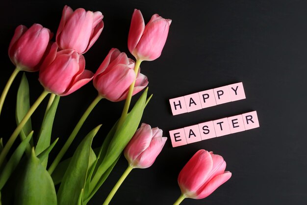 Happy easter! Easter background with pink tulips. Spring holiday concept.