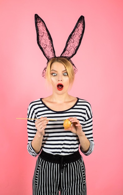 happy easter easter day easter egg easter bunny woman holding painting brush surprised woman
