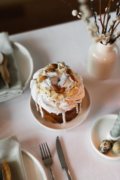 Happy Easter Easter festive spring table setting decoration eggs Easter cake willow branches in vase