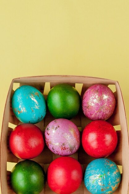 Happy Easter eggs yellow background