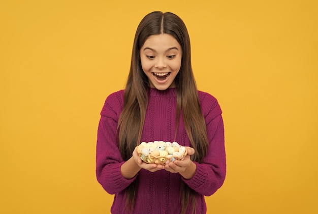 Happy easter holiday child hold quail eggs teenager girl wear smiling easter bunny hunt traditional holiday food ready for party happy childhood cheerful bunny kid