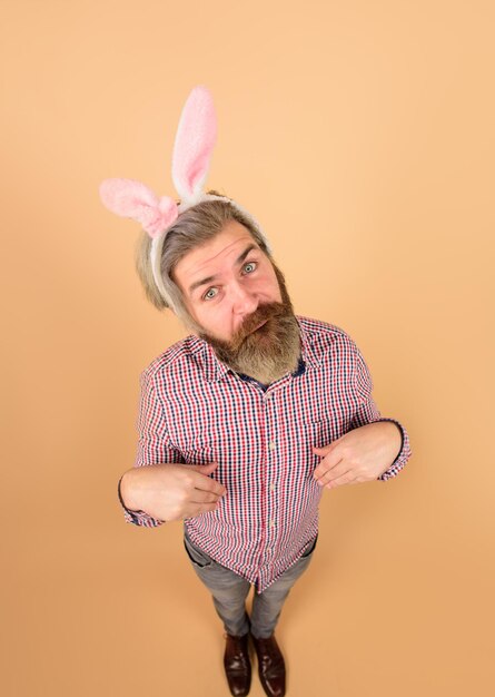 Happy easter man with rabbit ears in full height excited man with bunny ears easter bunny easter day