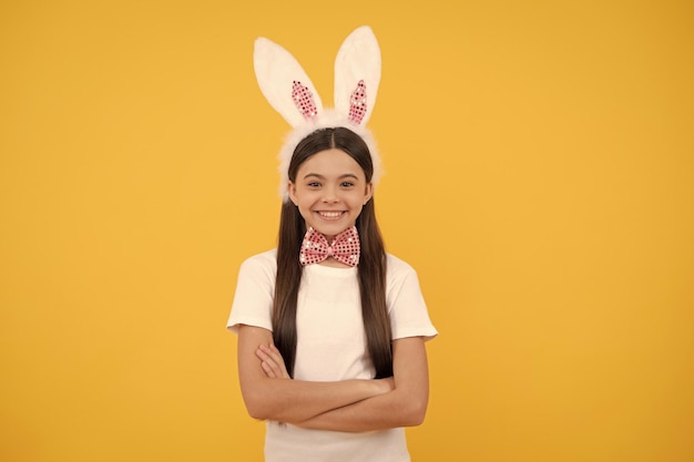 Happy easter teen girl in bunny ears and bow tie easter