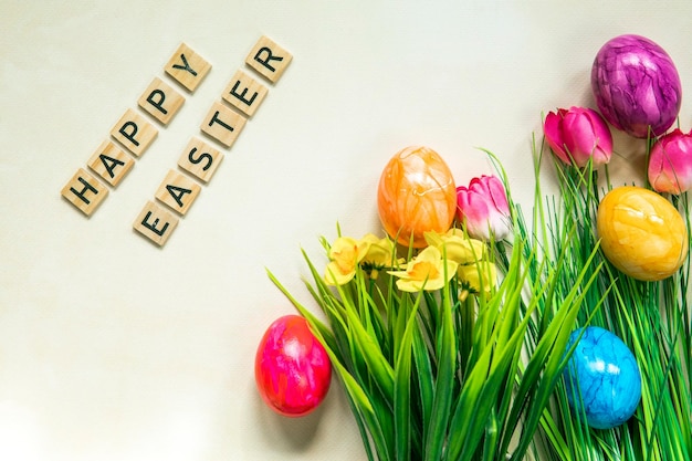 Happy easter text with colorful paineted easter eggs in fresh green grass animation colorful easter