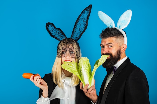 Happy Easter. Woman comic, funny and handsome man are wearing bunny ears. Easter sale concept. Copy space. Discount