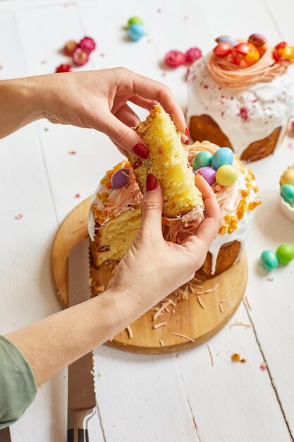 Happy Easter Woman cut Easter cake for the holiday