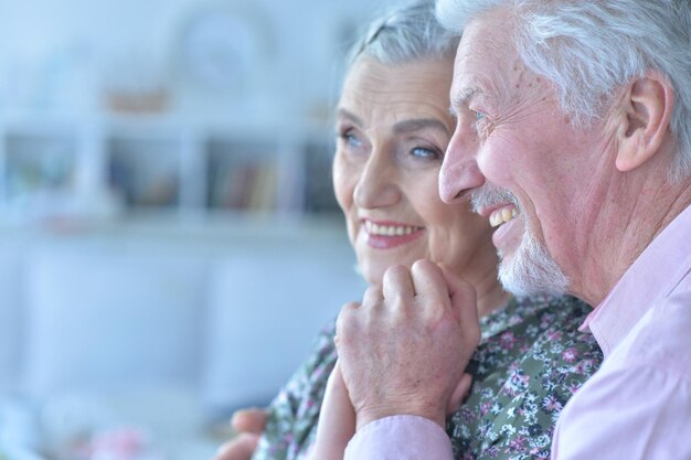 Happy elderly couple embracing