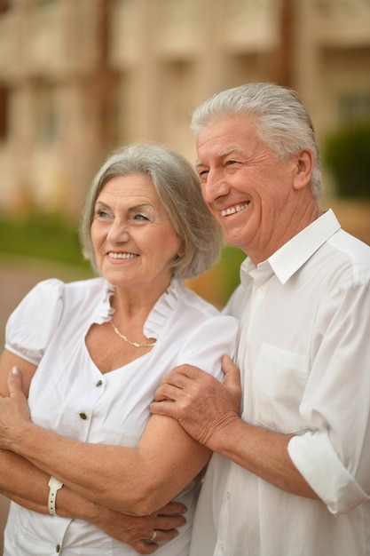 Happy elderly couple embracing