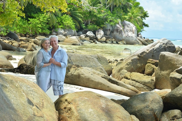 Happy elderly couple hugging