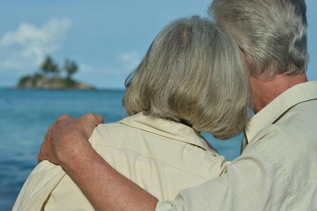 Happy elderly couple hugging