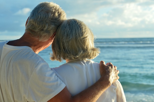 Happy elderly couple rest at tropical beac