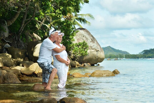 Happy elderly couple resting at tropical resort