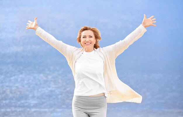 Happy elderly woman outdoors