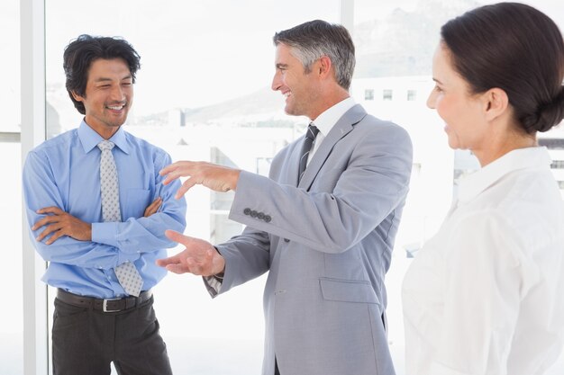 Happy employees having a discussion