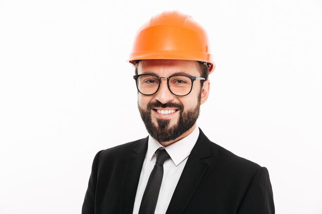 Happy engineer businessman in helmet.