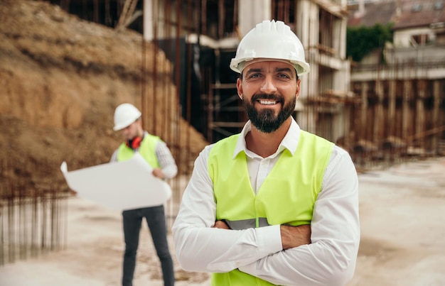 Happy engineer on construction site