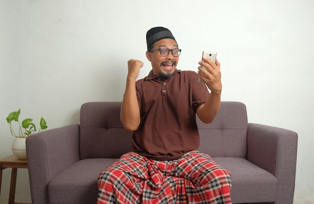 Happy expression of man looking phone screen