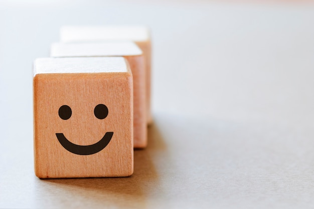 Photo happy face emotion on dice side