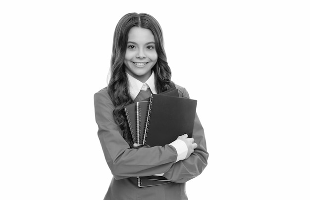 Happy face of teen girl with long curly hair hold school workbook isolated on white school