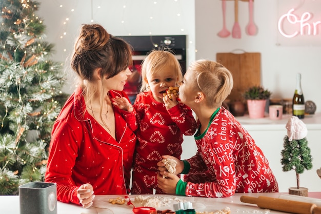 Happy family bake cookies for christmas eat