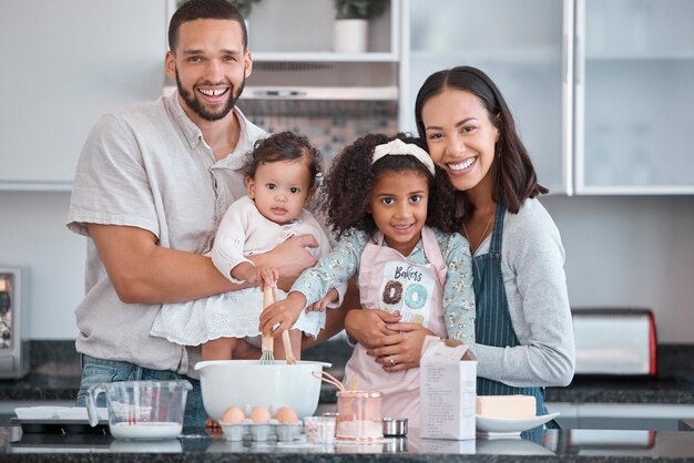 Happy family baking and learning while teaching girl to bake in kitchen counter love and fun together in home Dad mom and girl kids or baby with food ingredients and flour for breakfast in home