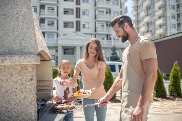 Happy family at a barbecue together