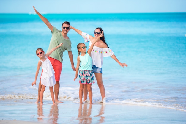 Happy family on the beach during summer vacation