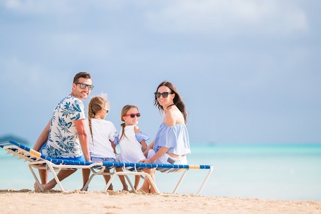 Happy family on the beach during summer vacation