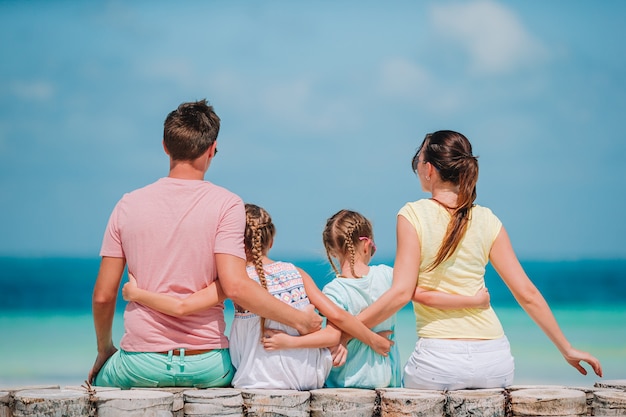 Happy family on the beach during summer vacation