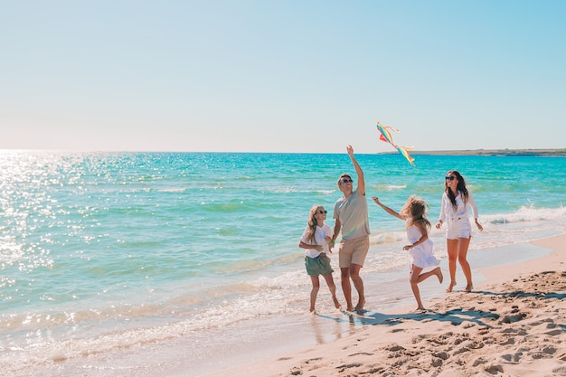 Happy family on a beach during summer vacation