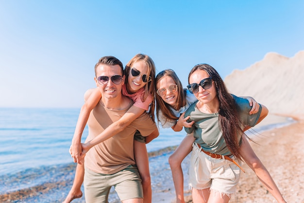 Happy family on a beach during summer vacation