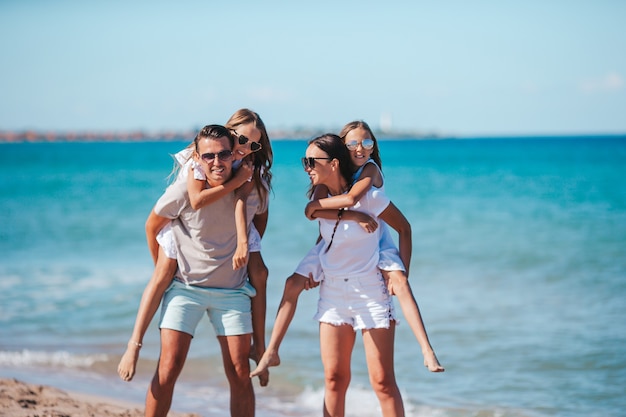 Happy family on the beach during summer vacation