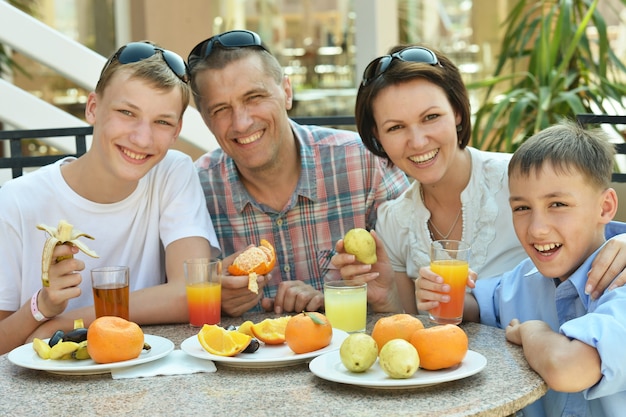 Happy family at breakfast on the table